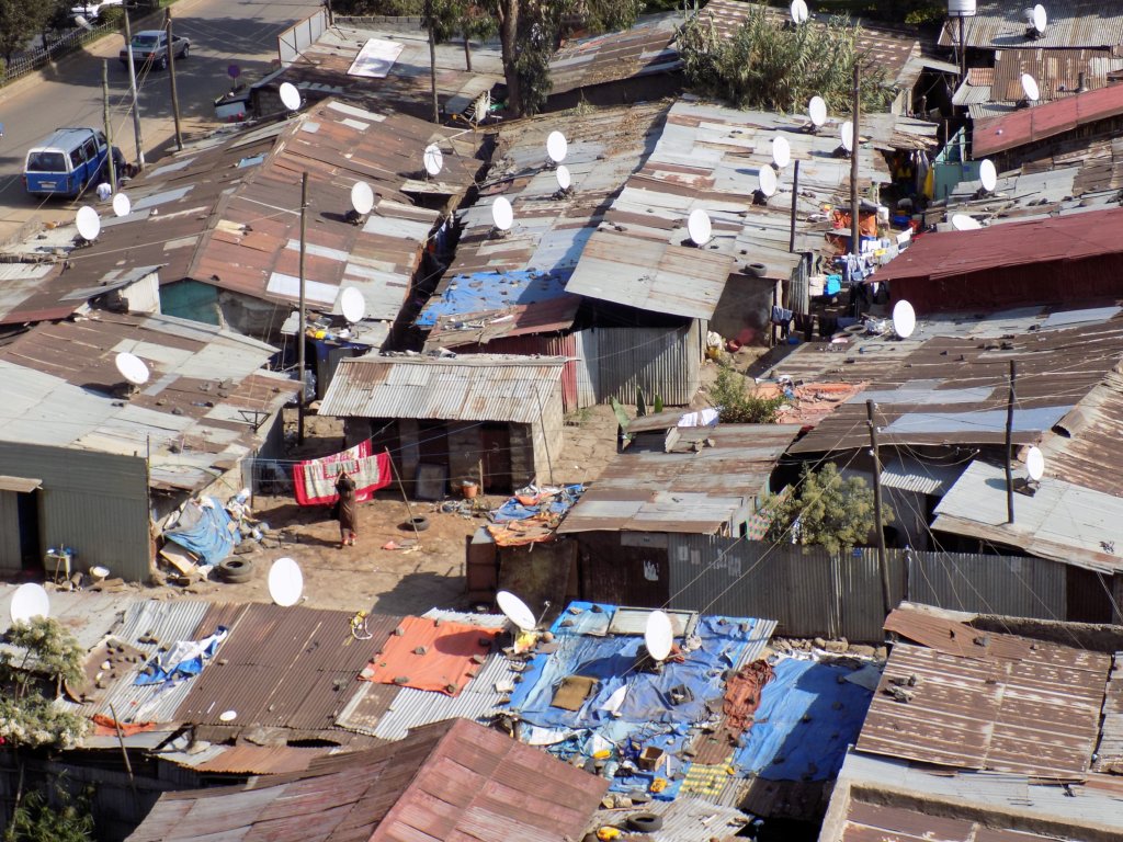 This photo shows satellite dishes on the corrugated roofs of the shanty town in central Addis Ababa