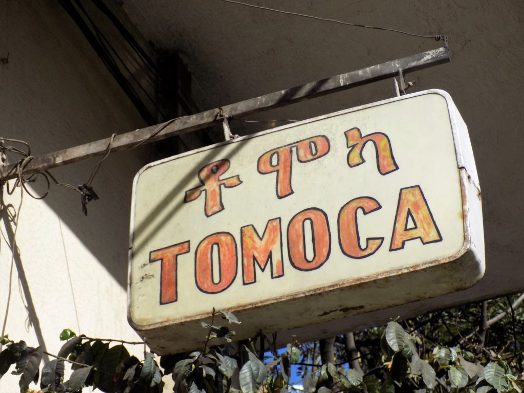 This photo shows the old sign outside Tomoca coffee shop