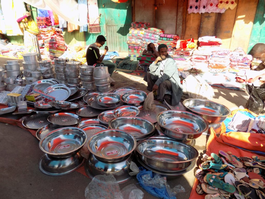 This photo shows a stall selling metal kitchenware