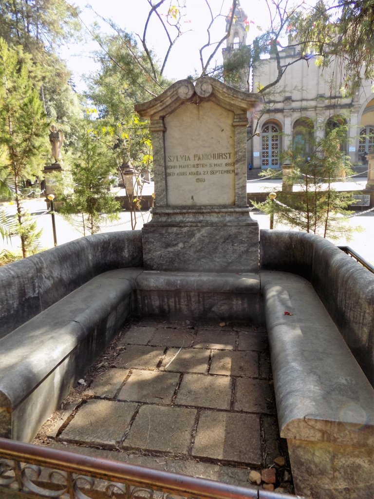 This photo shows a long shot of Sylvia's tomb with the stone benches where you can sit and read