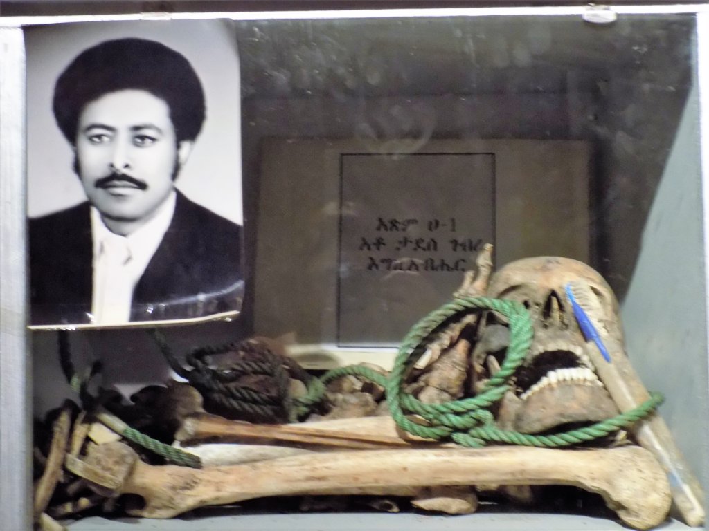 This photo shows skeletal remains along with a photo of one man murdered by the Derg 