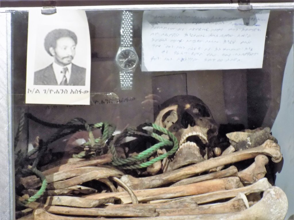 This photo shows skeletal remains along with a photo of one man murdered by the Derg 