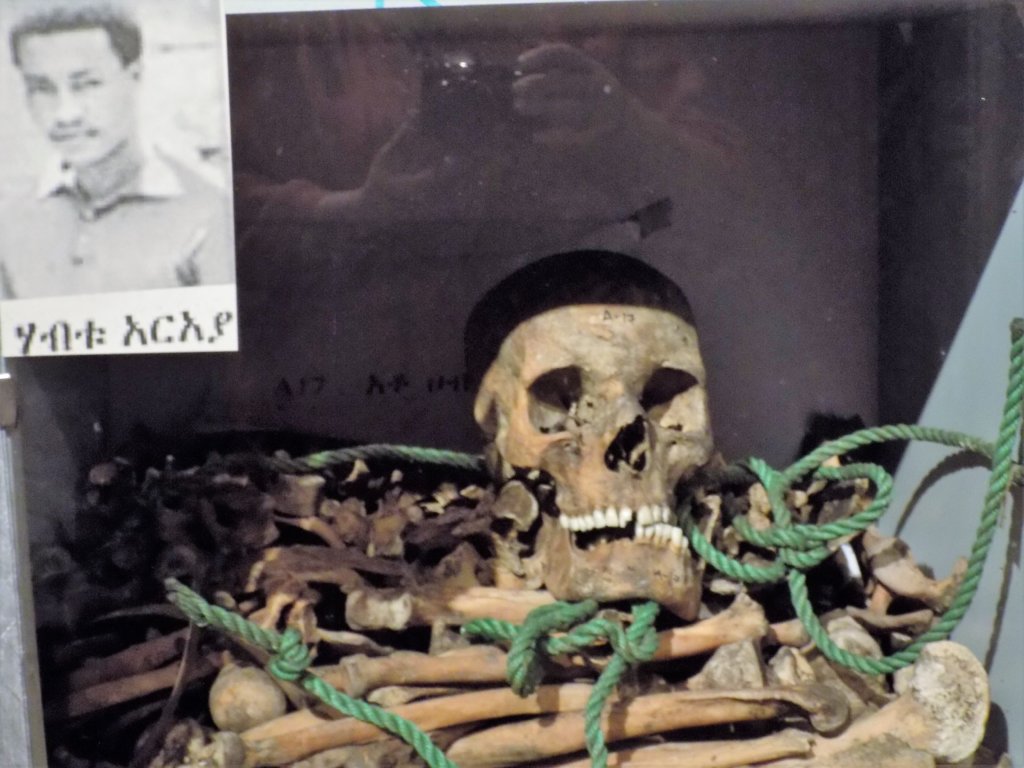 This photo shows skeletal remains along with a photo of one man murdered by the Derg 