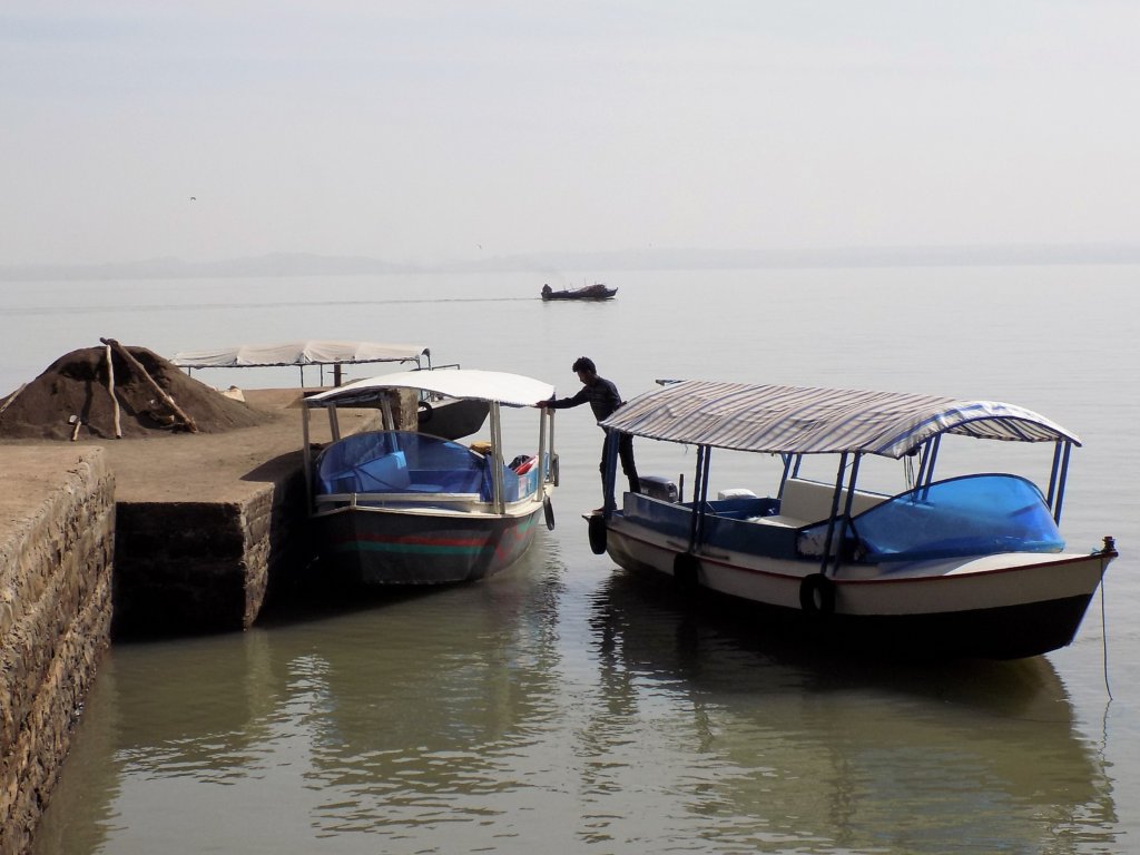 This photo shows the small covered motorboat which we went on to visit the monasteries of the Zege Peninsula