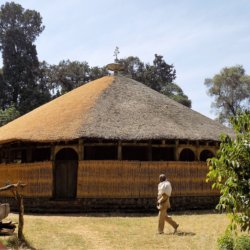 This photo shows the circular Azewa Maryam Church with a beautiful thatched roof