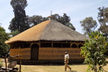 This photo shows the circular Azewa Maryam Church with a beautiful thatched roof