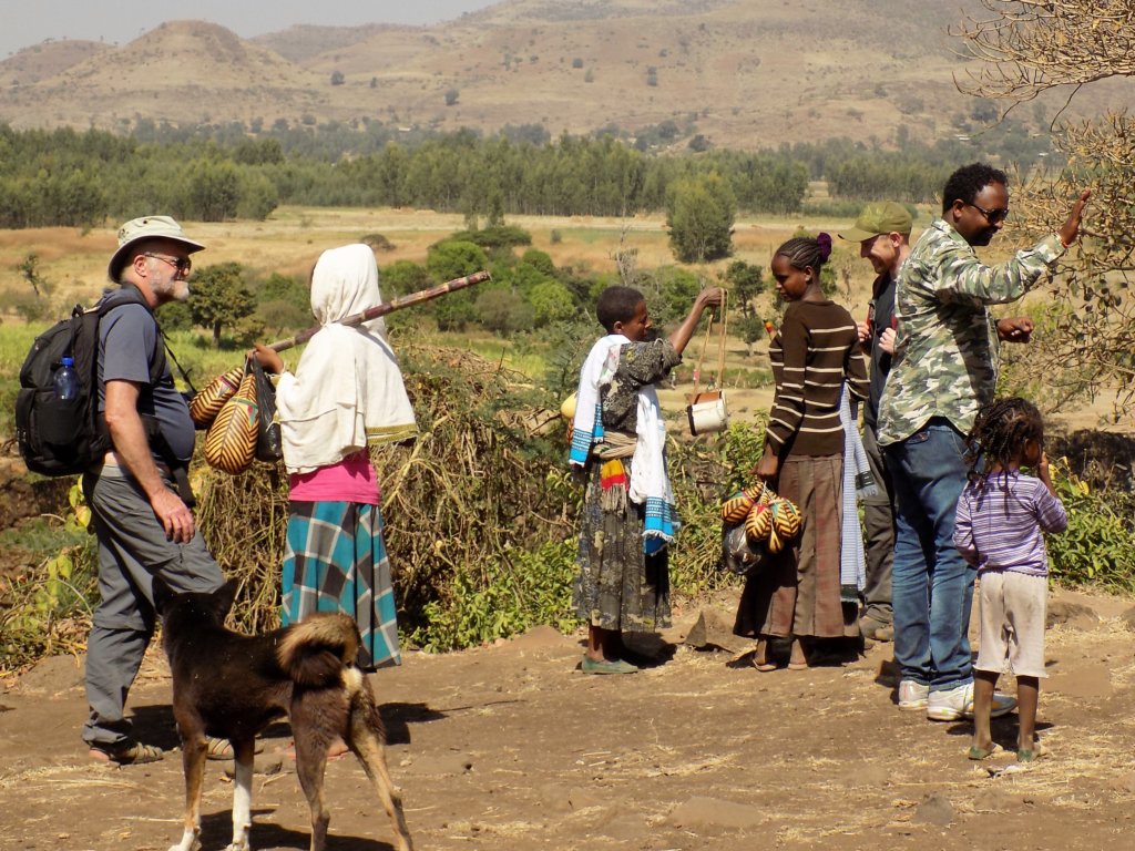 This photo shows a group of children with trinkets to sell