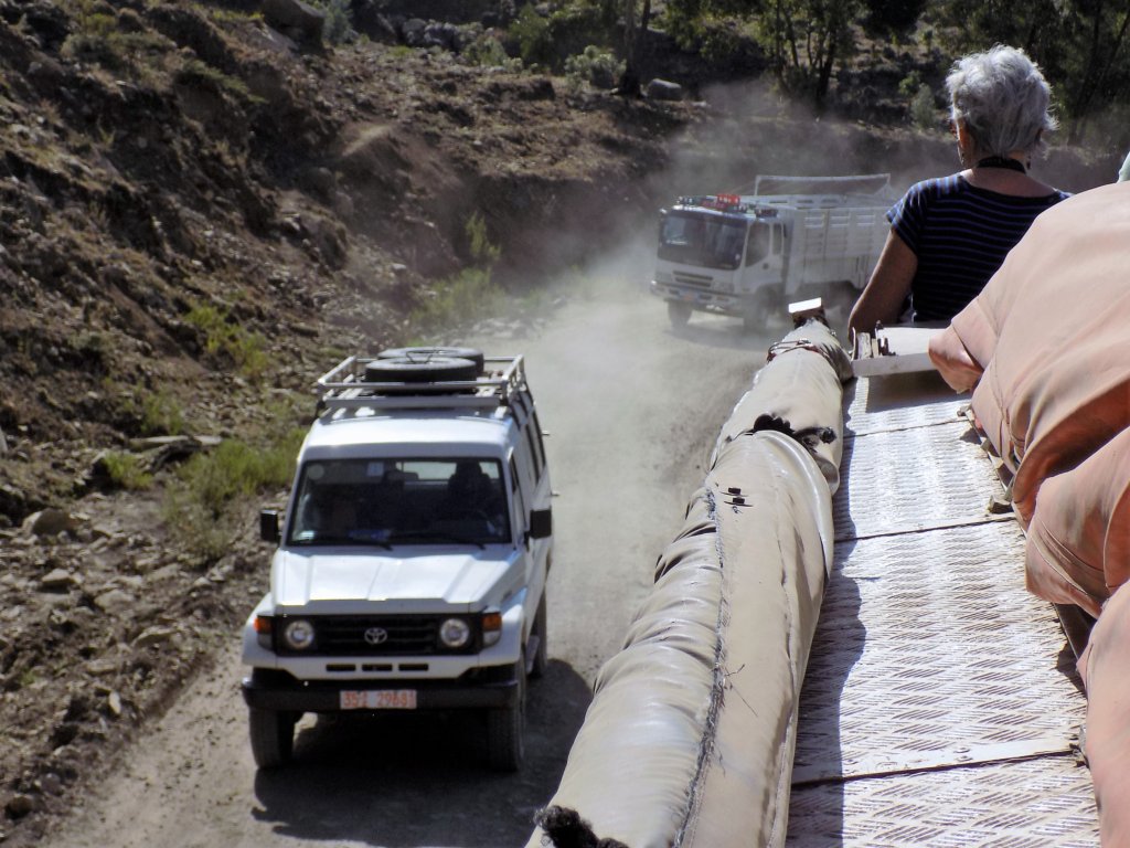 This photo shows a jeep and a lorry driving towards our truck. They are both throwing up an awful lot of dust from the loose road surface.