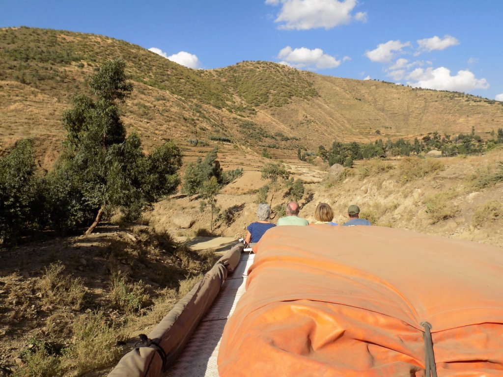 This photo shows the view from the rear roof seats towards the front of the truck and the view of the mountains beyond