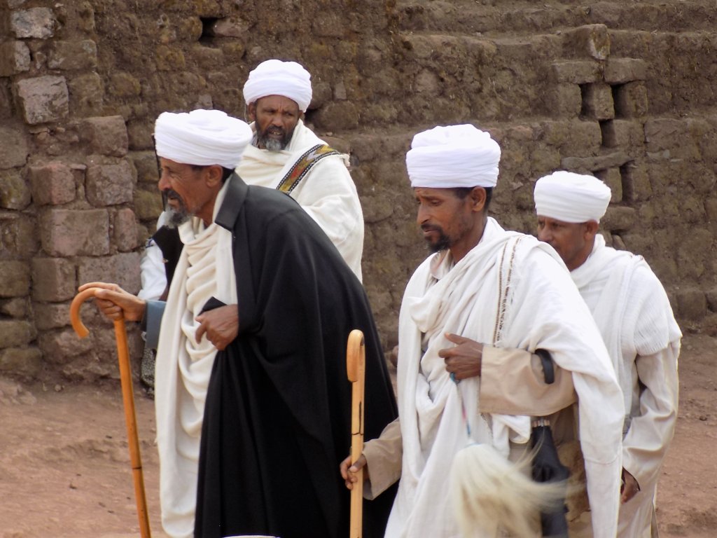 This photo shows four priests in their ceremonial garb on their way to Sunday services