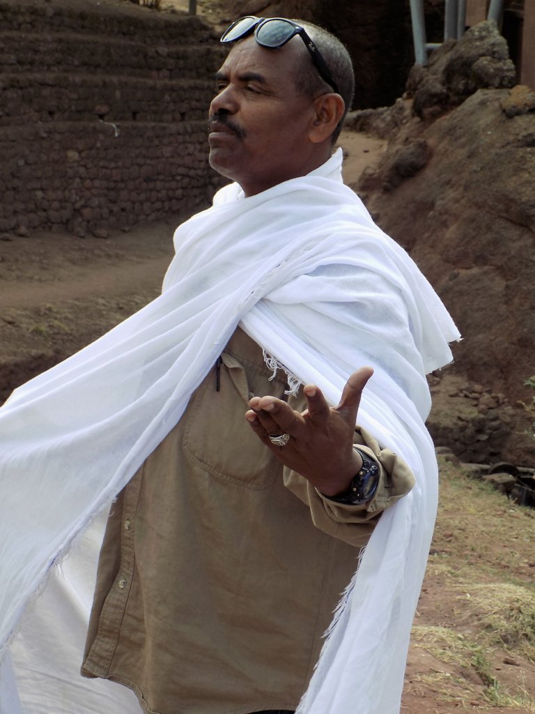 This photo shows our guide wearing a white robe over his ordinary clothes as a sign of respect
