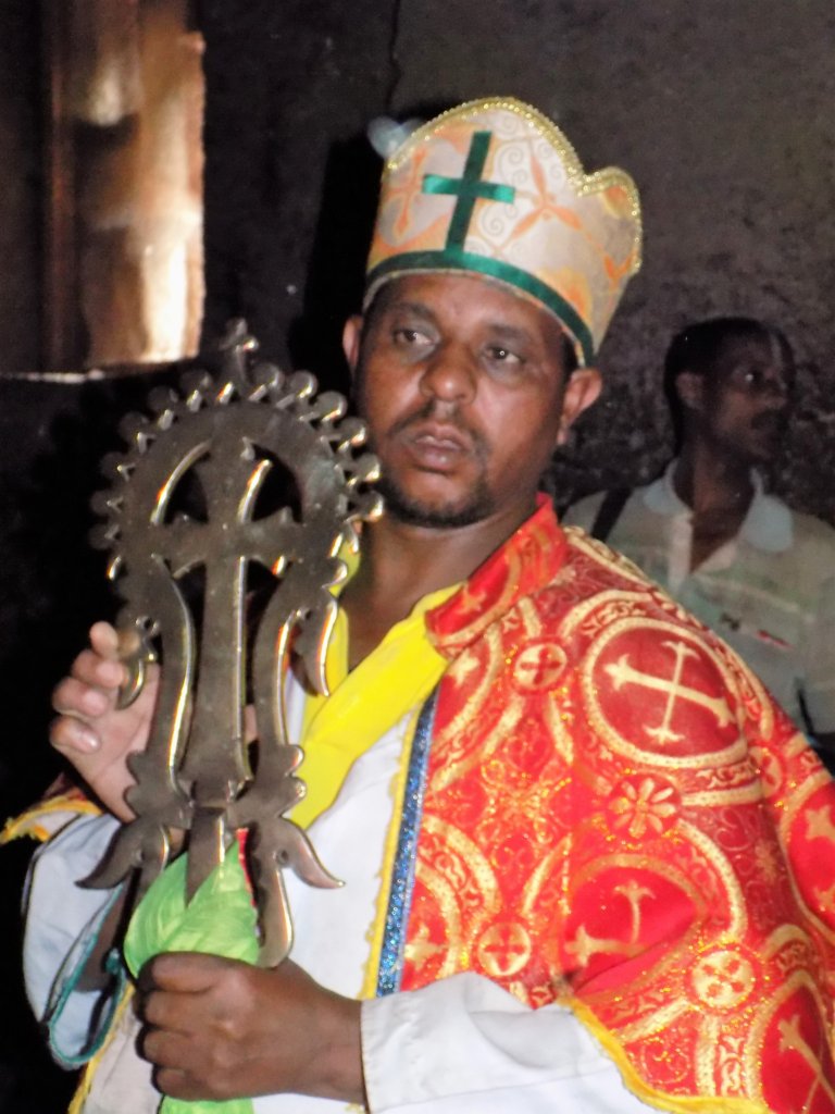 This photo shows a priest in ceremonial robes inside Bet Medhane Alem
