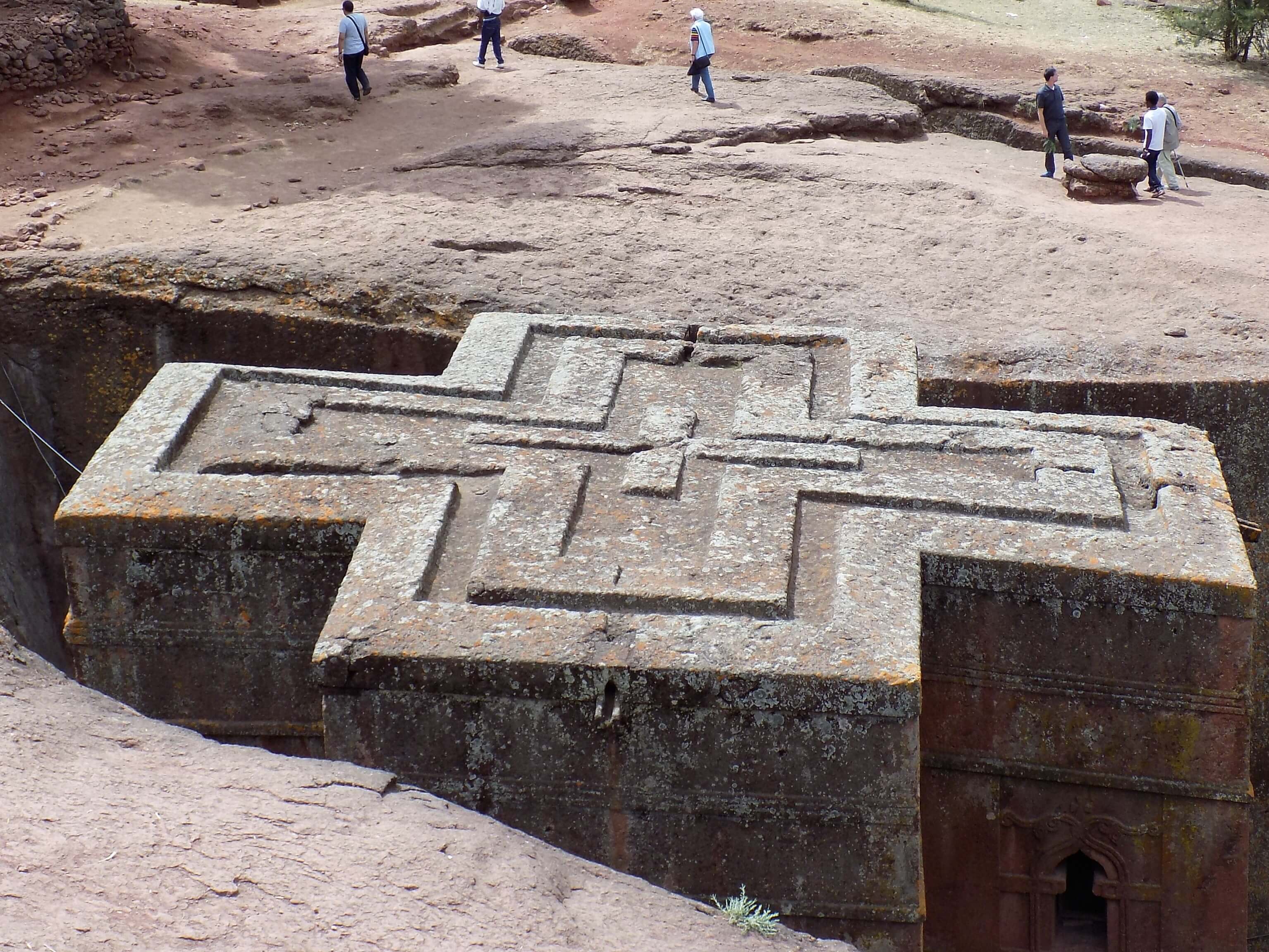 Priest in Bet Danaghel Church holding the Cross of King Lalibela. The  rock-hewn churches of Lalibela make it one of the greatest  Religio-Historical sites not only in Africa but in the Christian