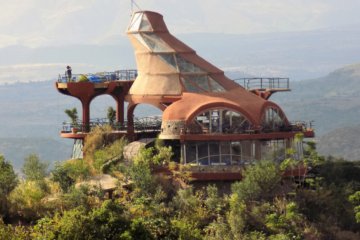 This photo shows the Ben Abeba restaurant viewed from the road out of Lalibela. The quirky architecture which got the restaurant its nickname can clearly be seen.
