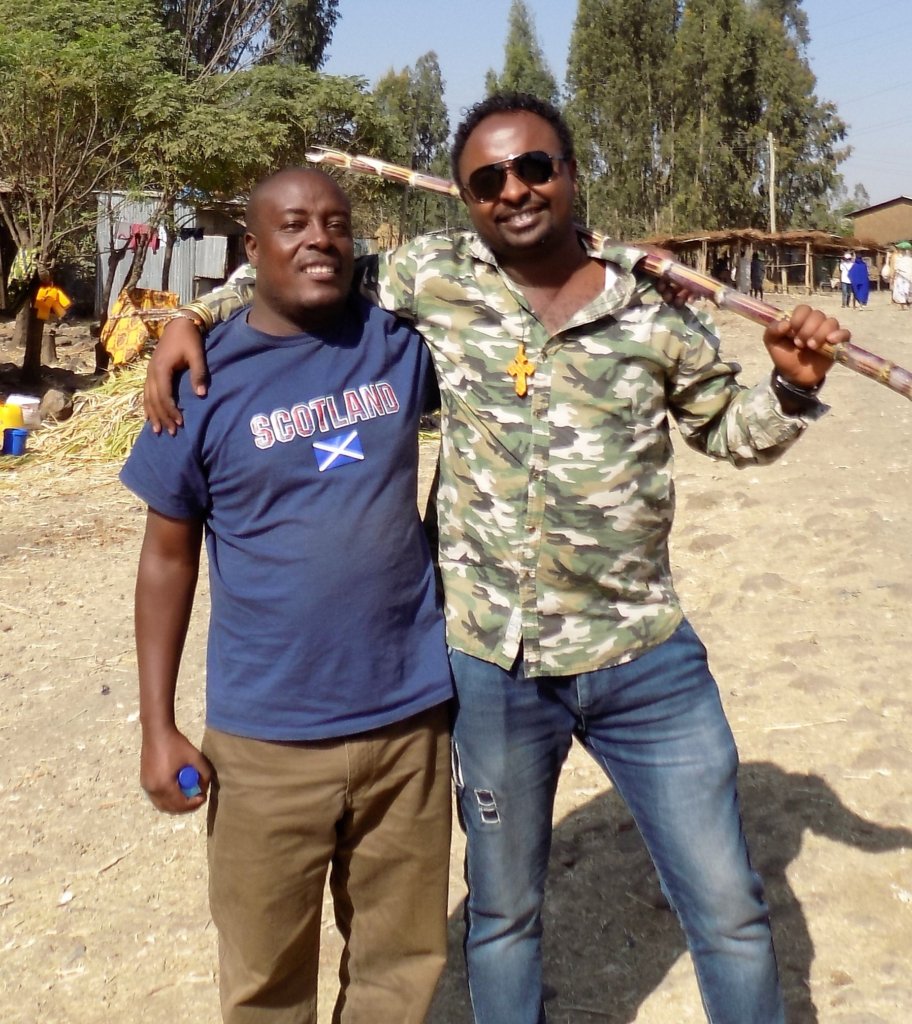 This photo shows our smiling driver and guide with their arms around each other