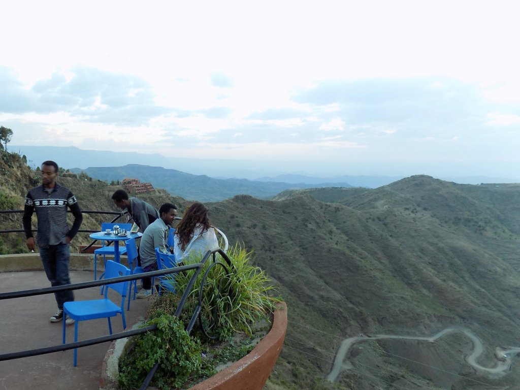 This photo shows people sitting on one of the pods looking out over the surrounding countryside