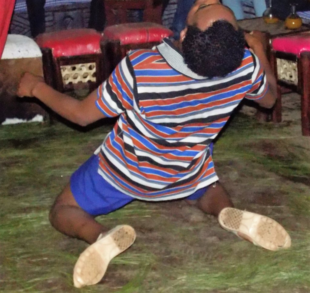 This photo shows a local guy doing some kind of limbo dance during a night out in Bahir Dar