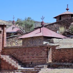 This photo shows the collection of buildings which makes up the Abraha We Atsbeha Church