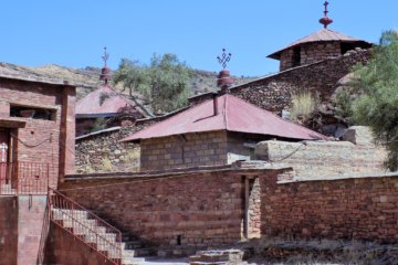 This photo shows the collection of buildings which makes up the Abraha We Atsbeha Church