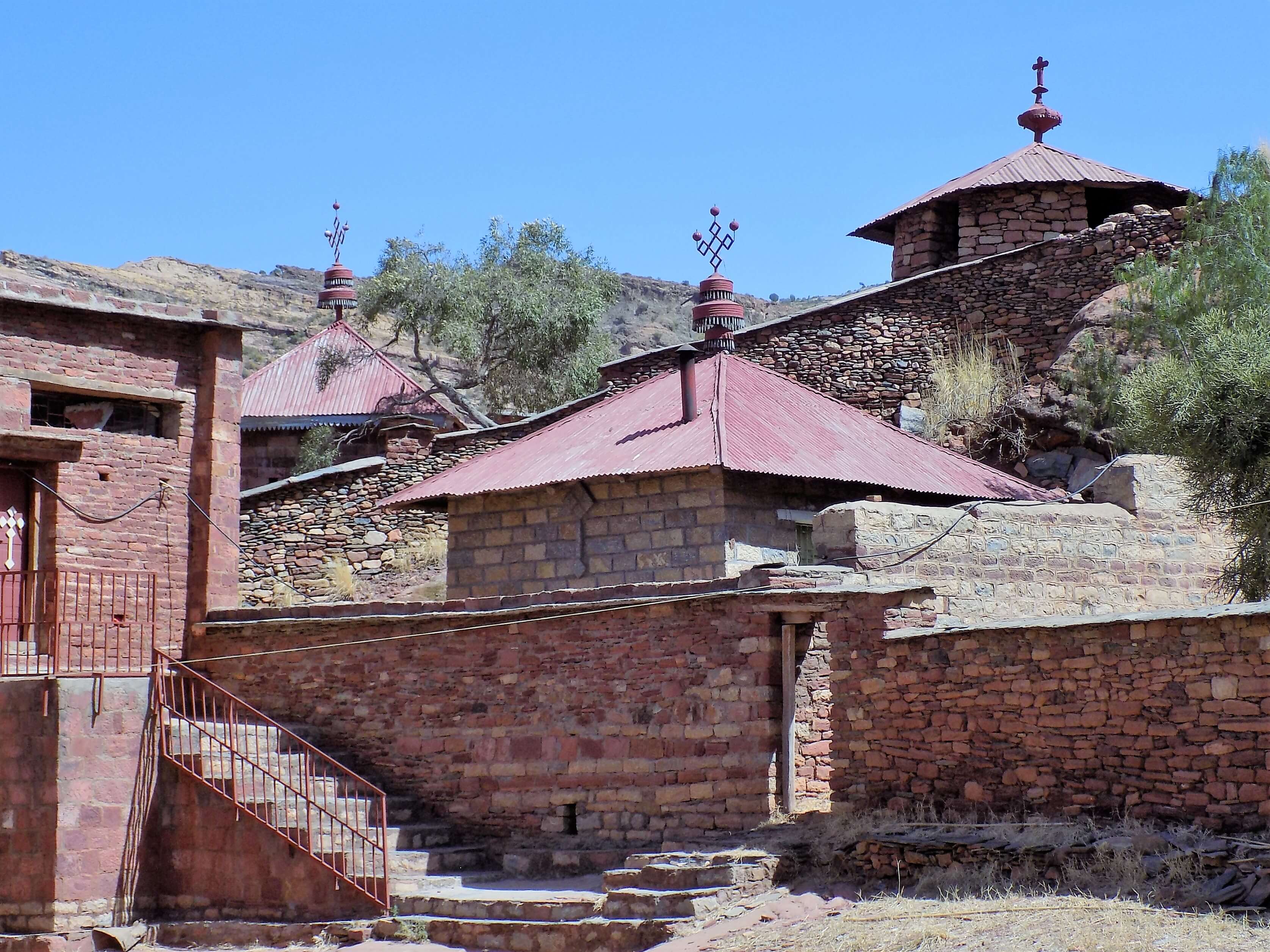 This photo shows the collection of buildings which makes up the Abraha We Atsbeha Church