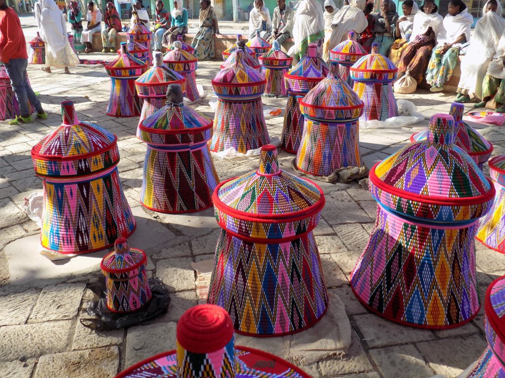 This photo shows several large colourful injera baskets, usually given as wedding presents