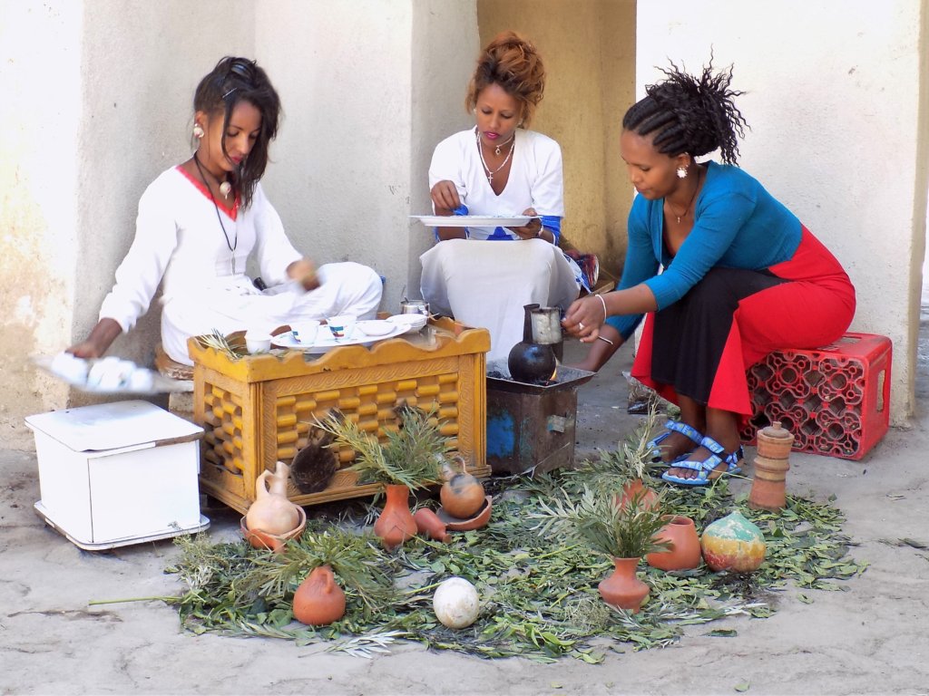This photo shows three Ethiopian ladies preparing coffee in the traditional way.