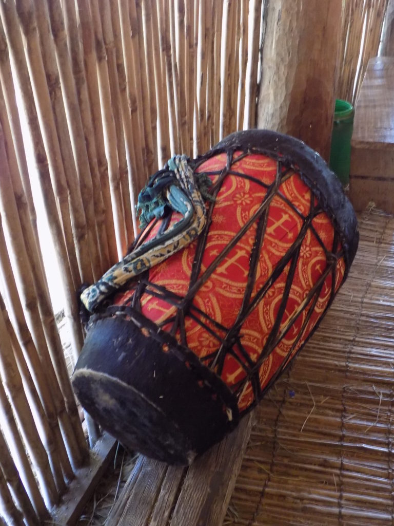 This photo shows a drum decorated in red and gold