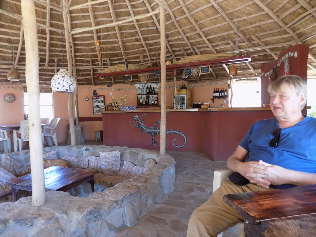 This photo shows Mark sitting in the bar at Tim and Kim Village