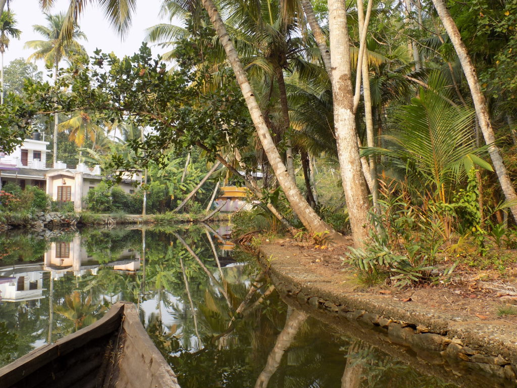 This photo shows the bow of our boat slicing through the still waters of the backwater