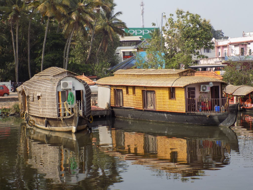 This photo shows a few of the different types of houseboat in Kollam