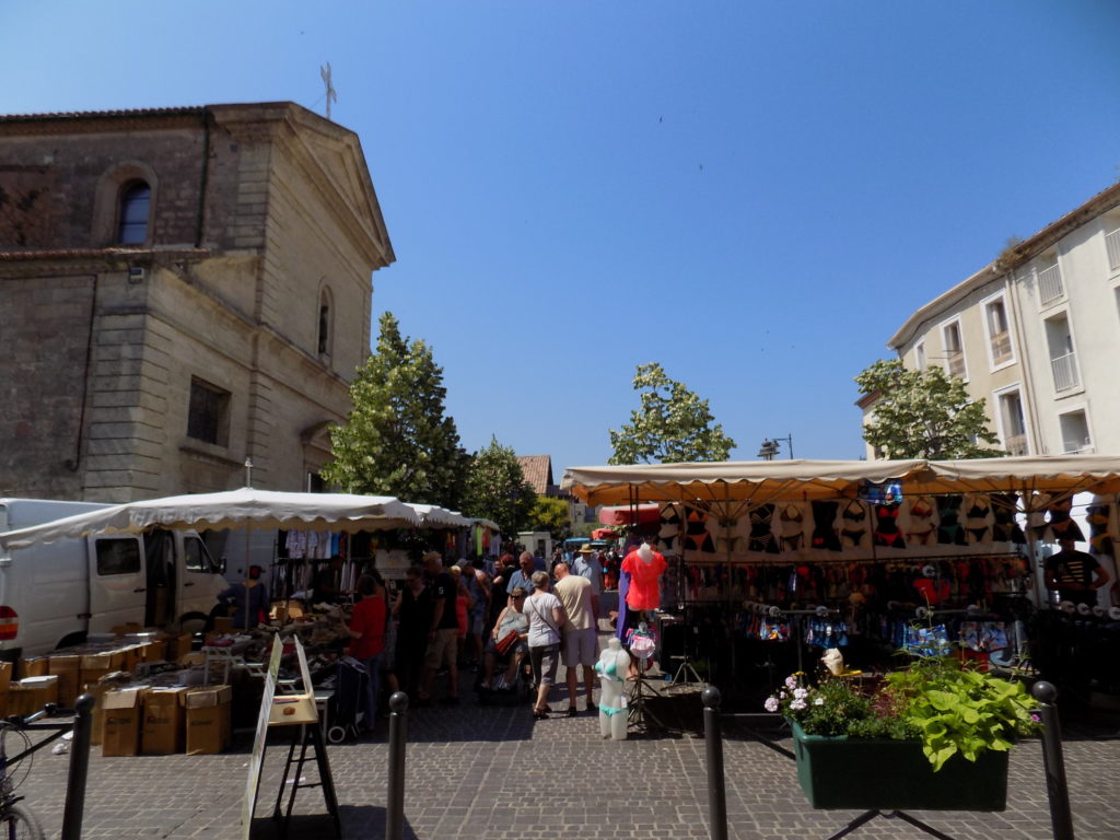 This photo shows stalls in Marseillan market on a sunny Tuesday morning.