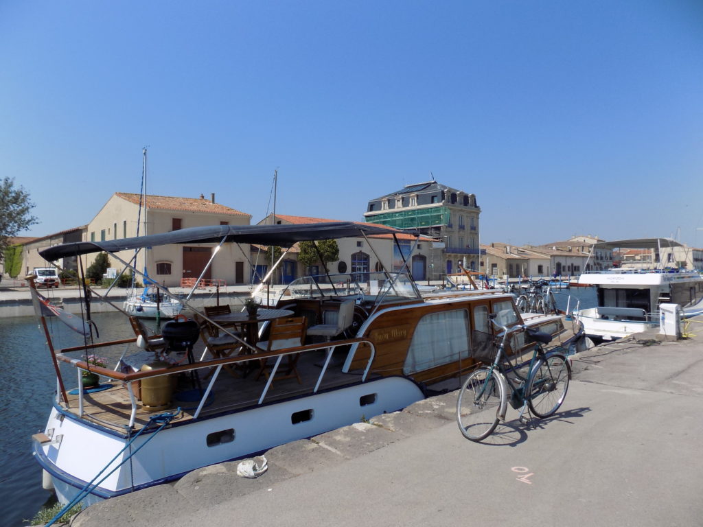 This photo shows the port at Marseillan with a couple of pleasure boats in the water.