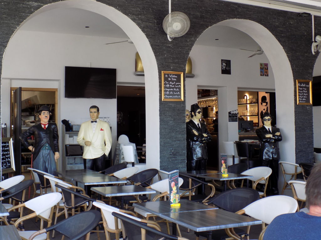 This photo shows the inside of les Jours Heureux restaurant with models of Charlie Chaplin, Humphrey Bogart and the Blues Brothers