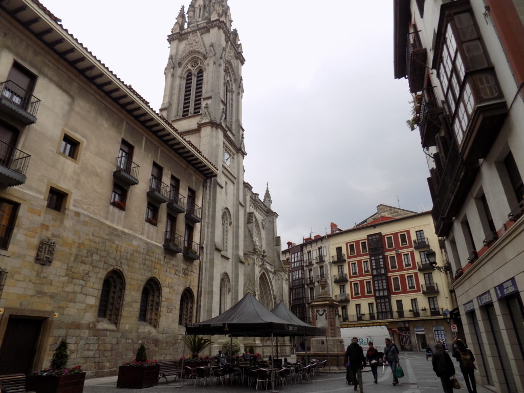 This photo shows a view of old Bilbao with traditional houses and a church