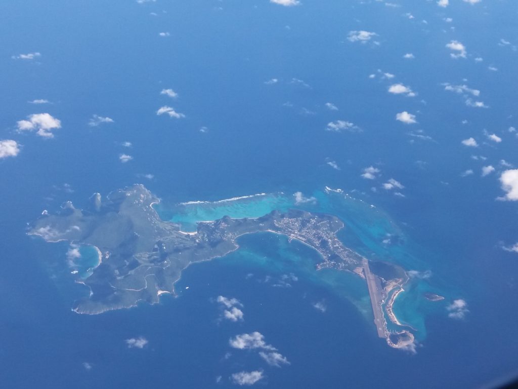 This image shows the island of Barbados. It was taken from the window on our flight from London Gatwick to Port of Spain, Trinidad. The sea around the island is a gorgeous shade of turquoise.