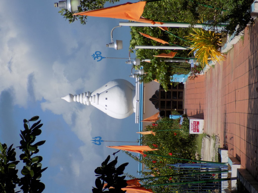 This photo shows the onion-shaped domes of the temple at the end of the causeway which links the island temple to the mainland