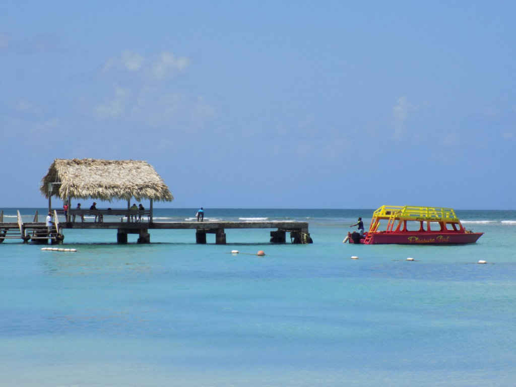 This photo shows the jetty and thatched shelter at Crown point, Tobago