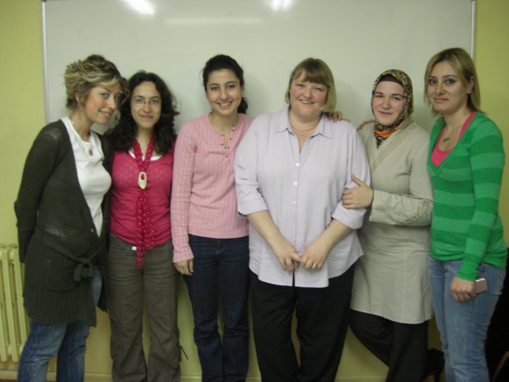 This photo shows me standing with a group of students in our classroom