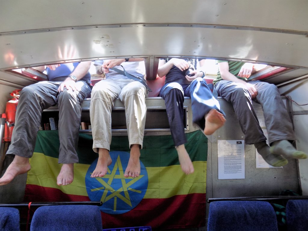 This photo shows people's legs when they were sitting on the roof seats