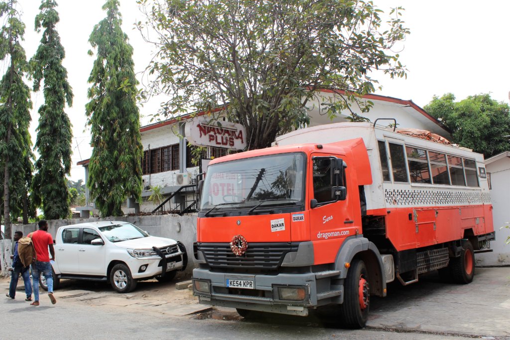 This photo shows our distinctive orange and white Dragoman truck parked outside our Accra hotel