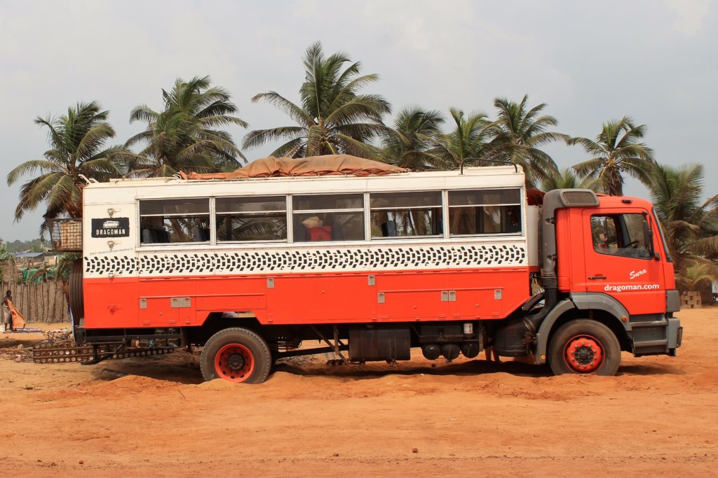 This photo shows our Dragoman truck stuck in soft sand near the beach in Grand Popo