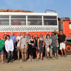 This photo shows a group of Dragoman passengers posing in front of their truck