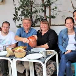 This picture shows the students and teachers enjoying the food they had prepared.