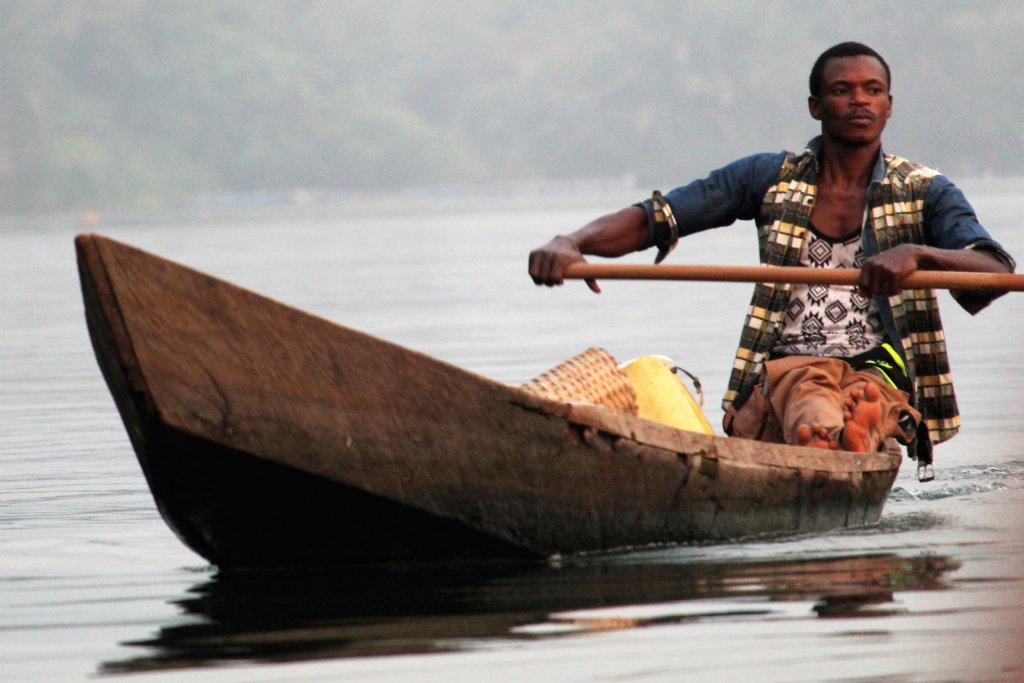 This photo shows a fisherman in his dugout canoe on Lake Volta