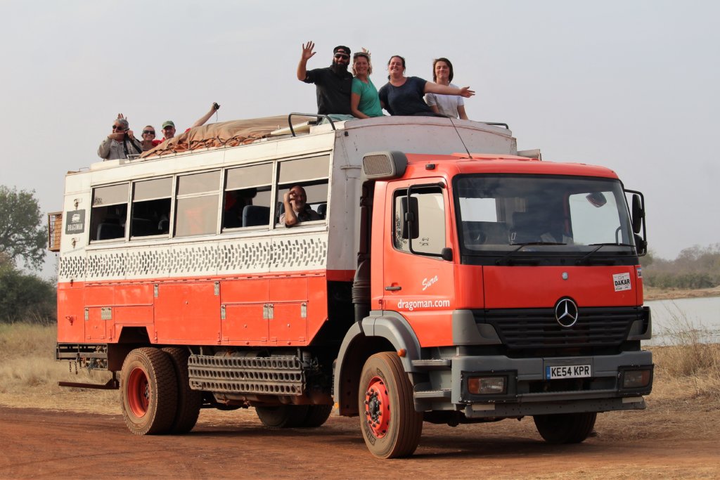 This photo shows our truck, Sura, with passengers using both the front and back roof seats