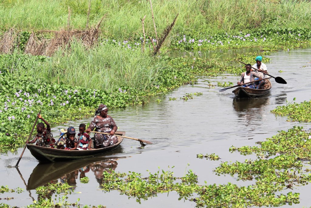 This photo shows two boats on the waterways of Ganvie