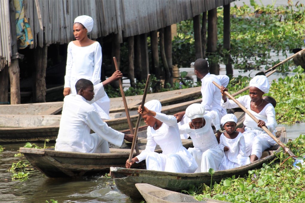 This photo shows a family all dressed in white on their way to church