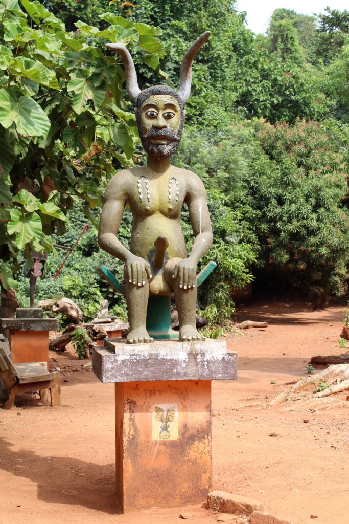This photo shows a statue of Legba with a large erect phallus