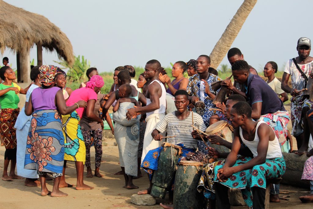 This photo shows dancers and drummers at the voodoo ceremony