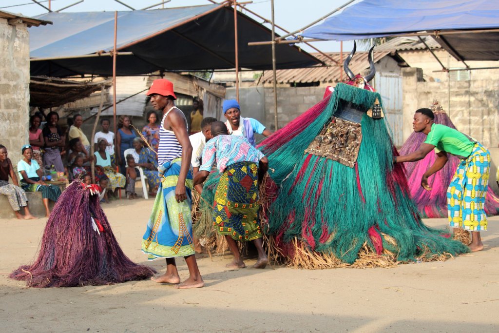 This photo shows Zangbetos and their helpers